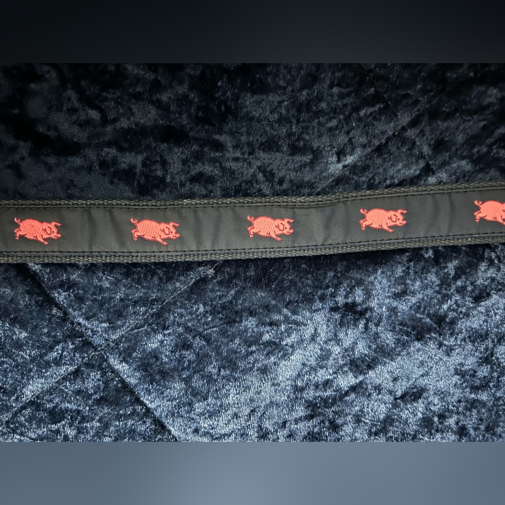 Men’s Size 32 J. Press Inc. leather and woven belt with stitched pink pigs.